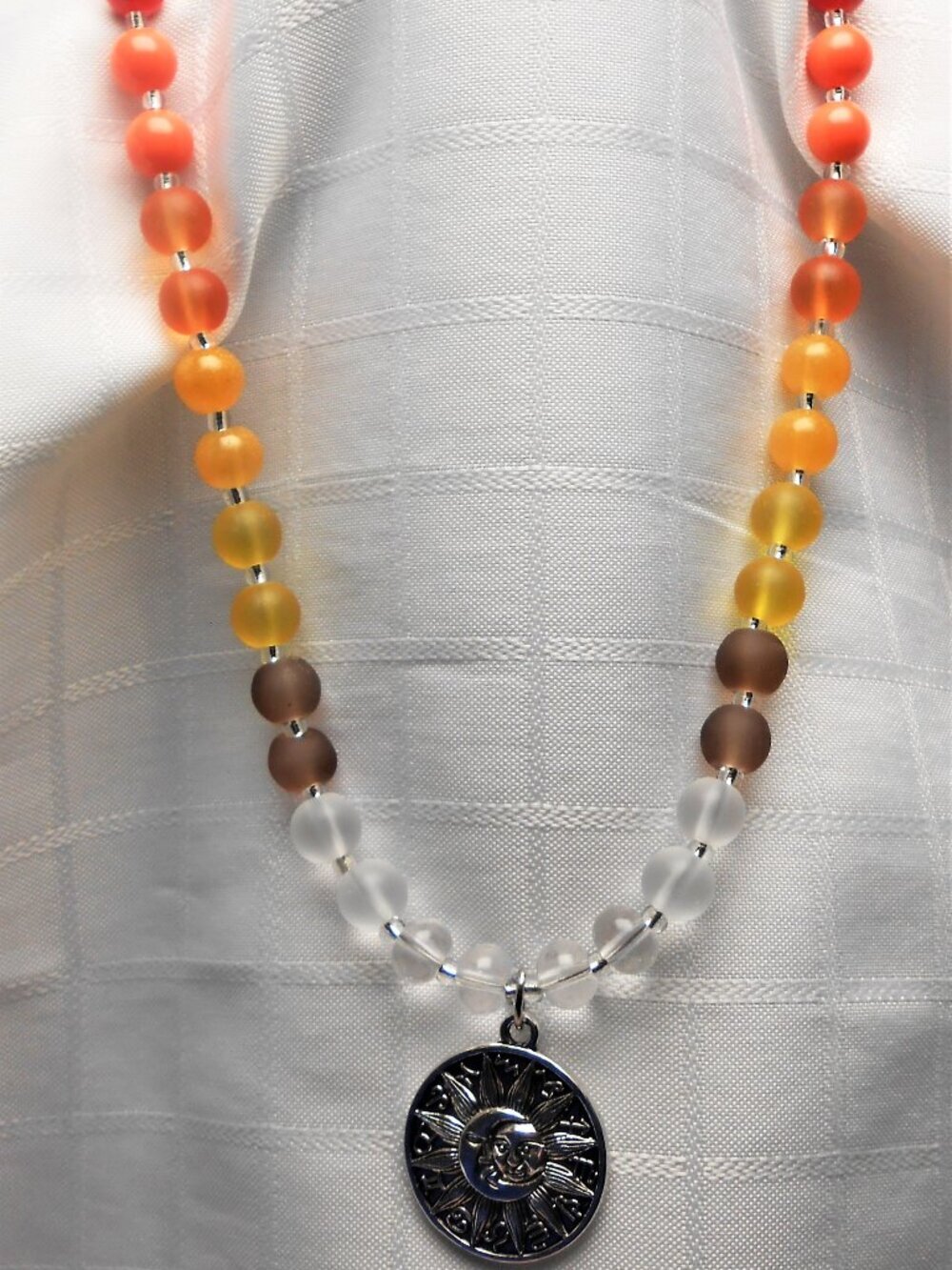 No762 Beautiful handmade long necklace with silver sun and moon pendant